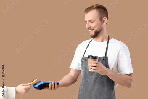 Male barista with coffee cu...