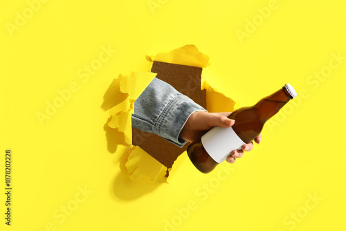 Bottle of cold beer and fem...