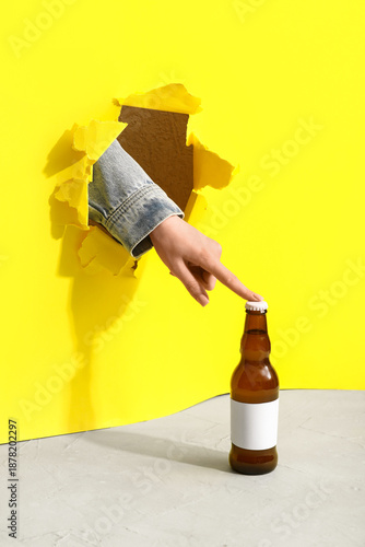 Bottle of cold beer and fem...
