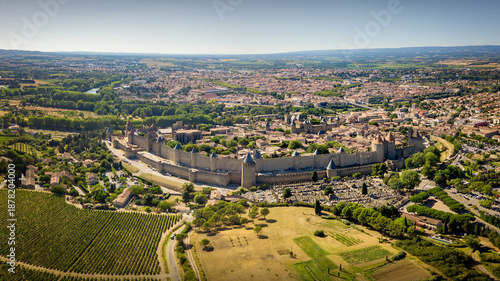 Old medieval city Carcassonne viewed from the sky on a sunny day. The old town has fortification walls from the middle age