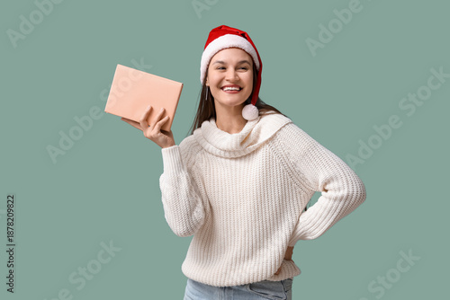 Happy young woman in Santa ...