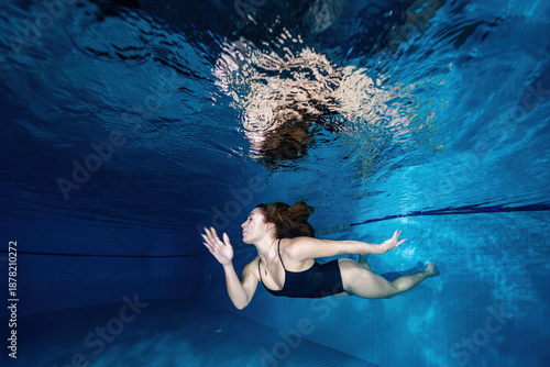 Underwater Female Swimmer Swimming in Pool – Aquatic Sports Photography