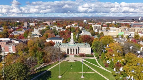 PENNSYLVANIA - 11.10.2025 - Terrific aerial footage circling clockwise around Penn State University's Old Main building.