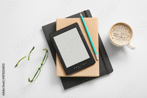 Modern e-reader with books,...
