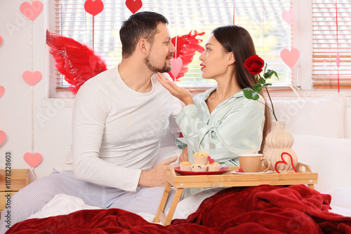 Young couple with breakfast...