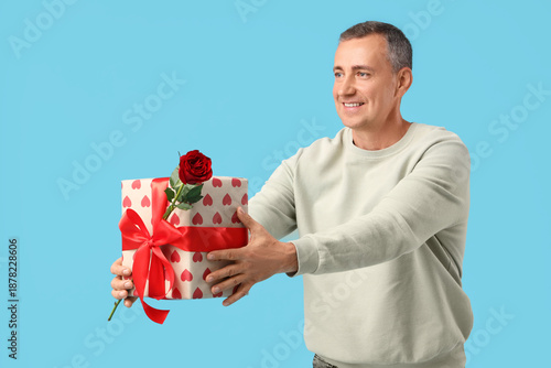 Happy mature man with rose ...