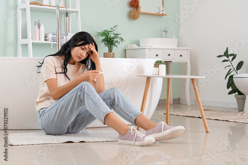 Upset young woman with preg...
