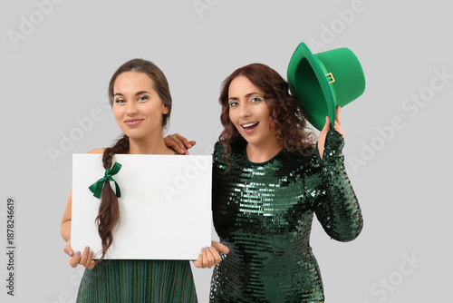 Women with blank poster on ...