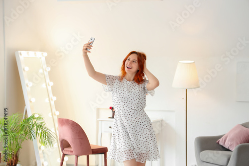 Young woman with mobile pho...