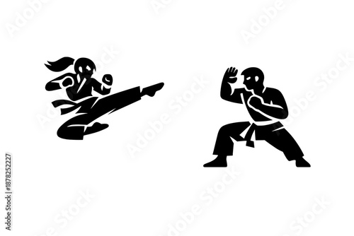 Woman performing high kick against male opponent in martial arts combat scene
