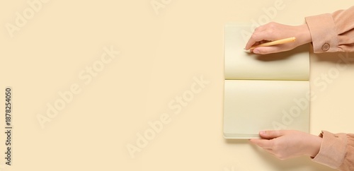 Woman writing in notebook o...