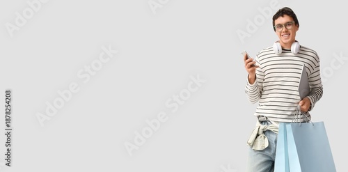 Stylish young man with shop...