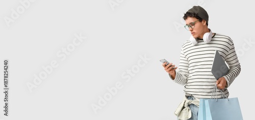 Stylish young man with shop...