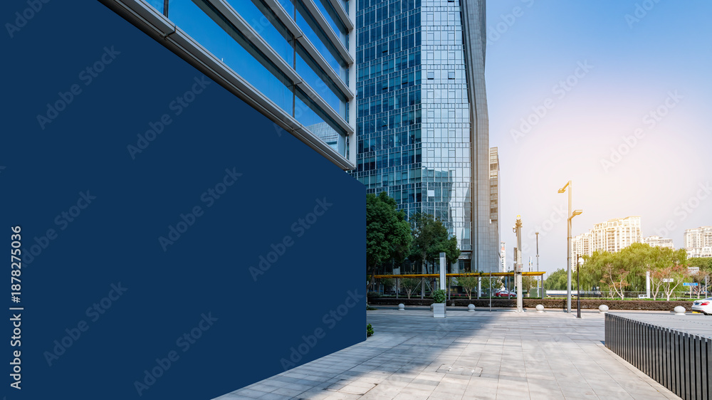 Fototapeta premium Modern Urban Building with Empty Blue Wall for Advertising
