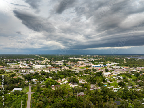 Wallpaper Mural Rainstorm over Charlotte Harbor in Florida. Heavy precipitation with moving and changing stormy cloudscape. Torontodigital.ca