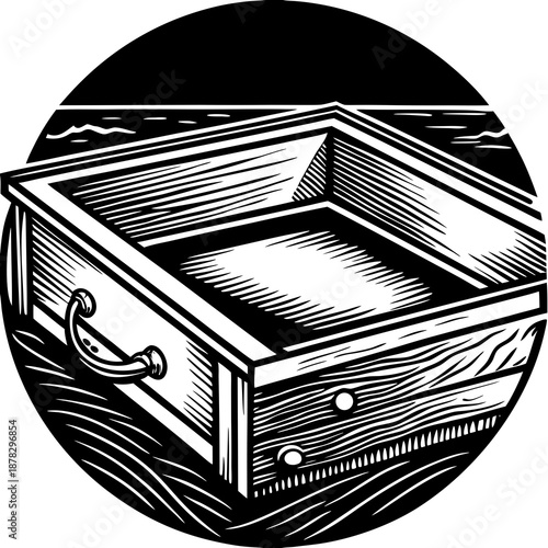 Open wooden drawer on textured surface