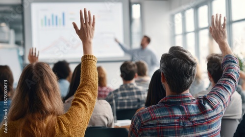 Education training class. Knowledge learning improvement study. A group of people raising their hands in front of a whiteboard in a classroom. The whiteboard displays a graph.