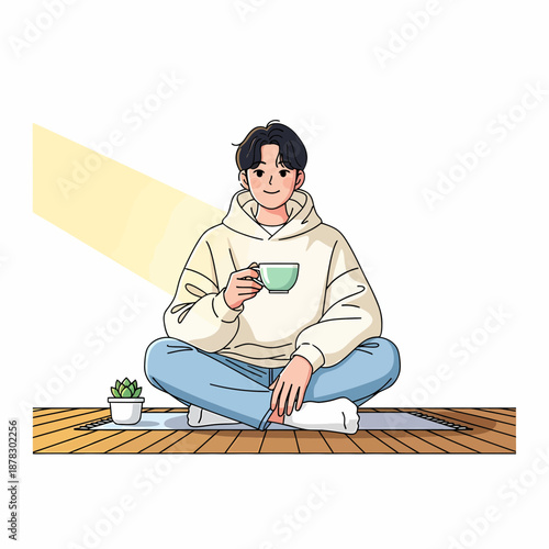 Serene young man enjoying a tranquil moment at home, sipping a warm drink in soft sunlight