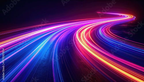 Abstract long exposure of neon light trails curving across a dark space