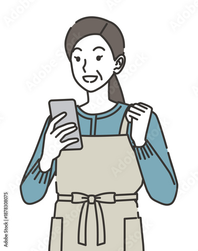 スマホを見て喜ぶ主婦