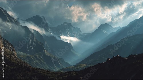 Mountain Range with Cloudy Sky and Sunlight.