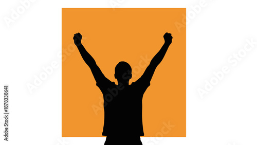 Silhouette of a person with arms raised in victory against orange background