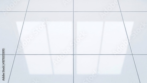 Glossy white square ceramic tiles with thin grey grout lines, reflecting light and creating a clean, modern surface.
