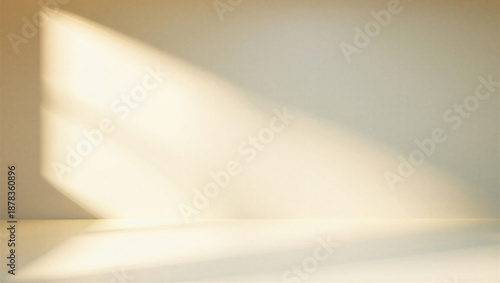 Tableau sur toile Soft natural light casting a warm glow on a blank wall