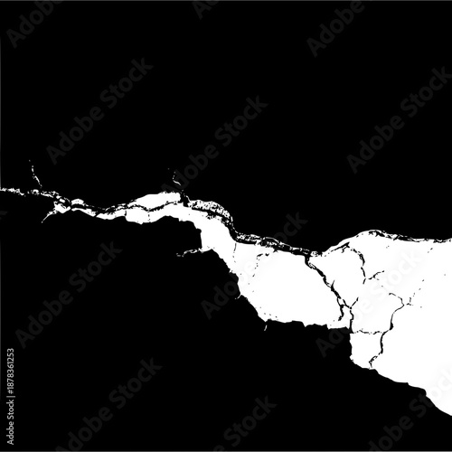 Abstract crack formation in black and white showing a split in the surface of the material used