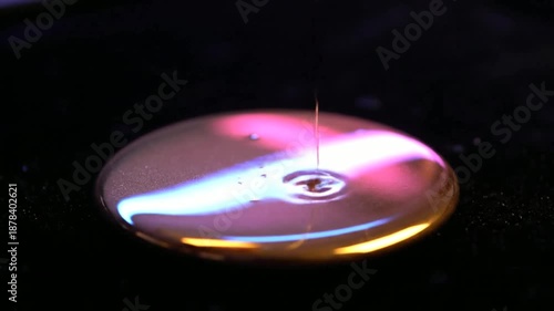 Spinning Metal Disk with Vibrant Light Reflections.