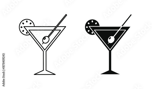 Two black and white cocktail glasses with olives and straws on a pure