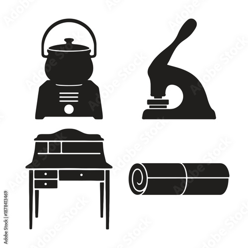 Black and white of kettle iron desk and rolled carpet