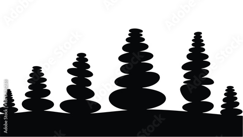 Zen stone stacks balanced perfectly against a white background, symbolizing harmony and peace.