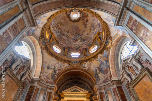 Frescoed dome and ornate baroque interior of a side chapel in the Basilica of Santa Sabina at the Aventine, Rome, Italy. Historic religious art