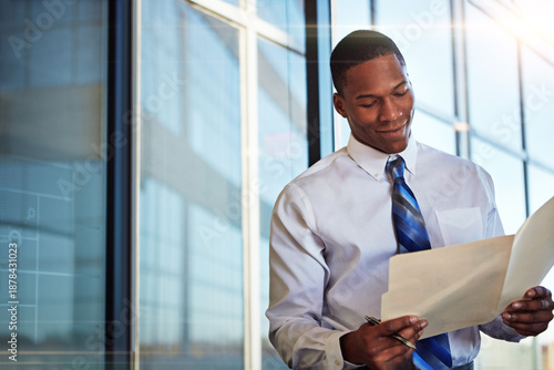 Photos Black man, lawyer and smile with folder in office for case file, witness statement and legal document