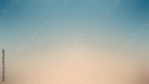 A blue and orange gradient   grainy textured color background with soft lighting effects