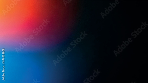 Abstract grainy textured color gradient background with blended hues of red, blue, and purple