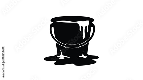 Black paint bucket with dripping liquid a striking silhouette