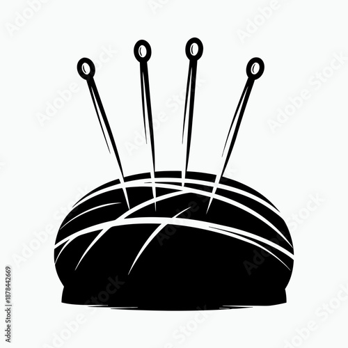 Sewing pin cushion with multiple needles in black silhouette  