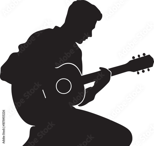 Silhouette of a Man Playing Acoustic Guitar