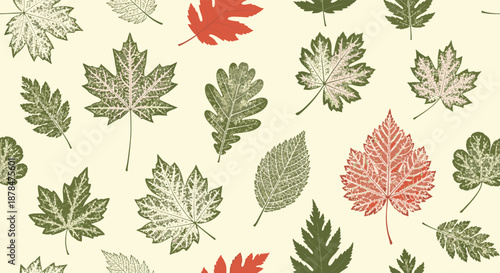 Beautiful autumn seamless pattern featuring various types of fall leaves in shades of green, earthy brown, and vibrant red on a cream background.