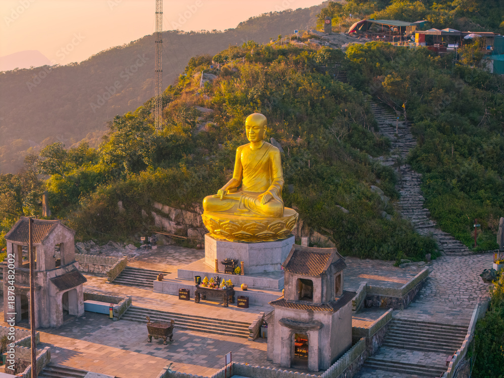 custom made wallpaper toronto digitalView of Golden statue of Buddha sitting in a lotus flower at ancient Buddhist complex at Yen Tu Mountain, Quang Ninh Province, Vietnam