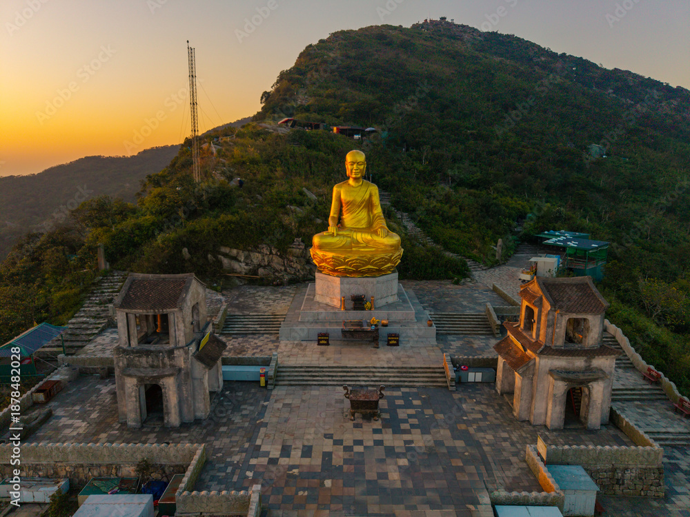 custom made wallpaper toronto digitalView of Golden statue of Buddha sitting in a lotus flower at ancient Buddhist complex at Yen Tu Mountain, Quang Ninh Province, Vietnam