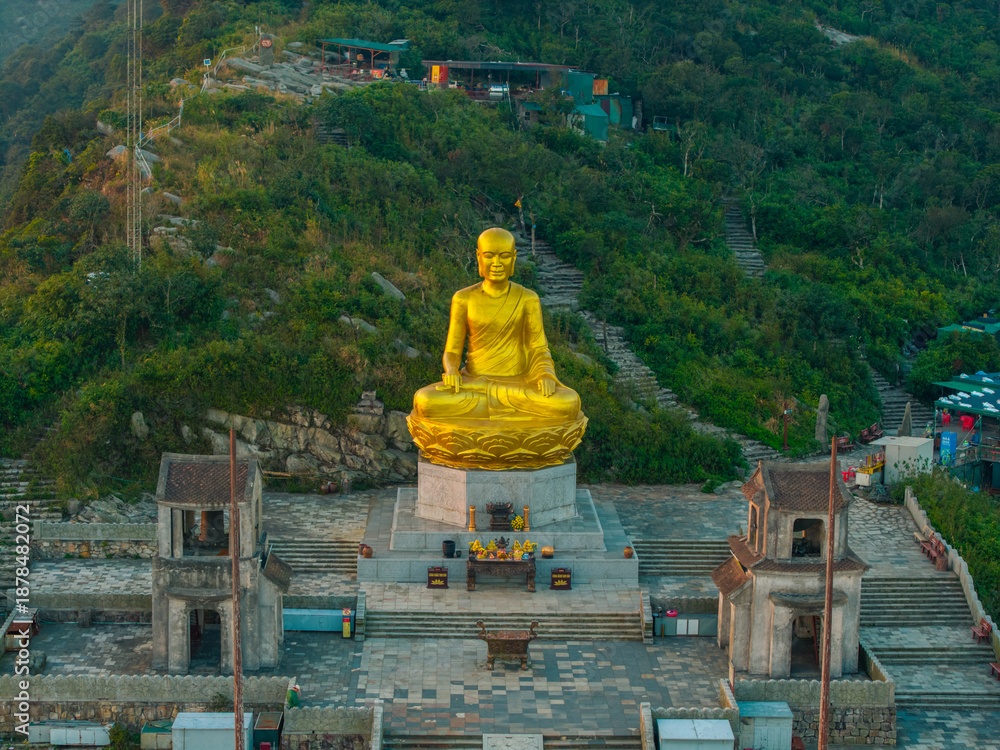 custom made wallpaper toronto digitalView of Golden statue of Buddha sitting in a lotus flower at ancient Buddhist complex at Yen Tu Mountain, Quang Ninh Province, Vietnam