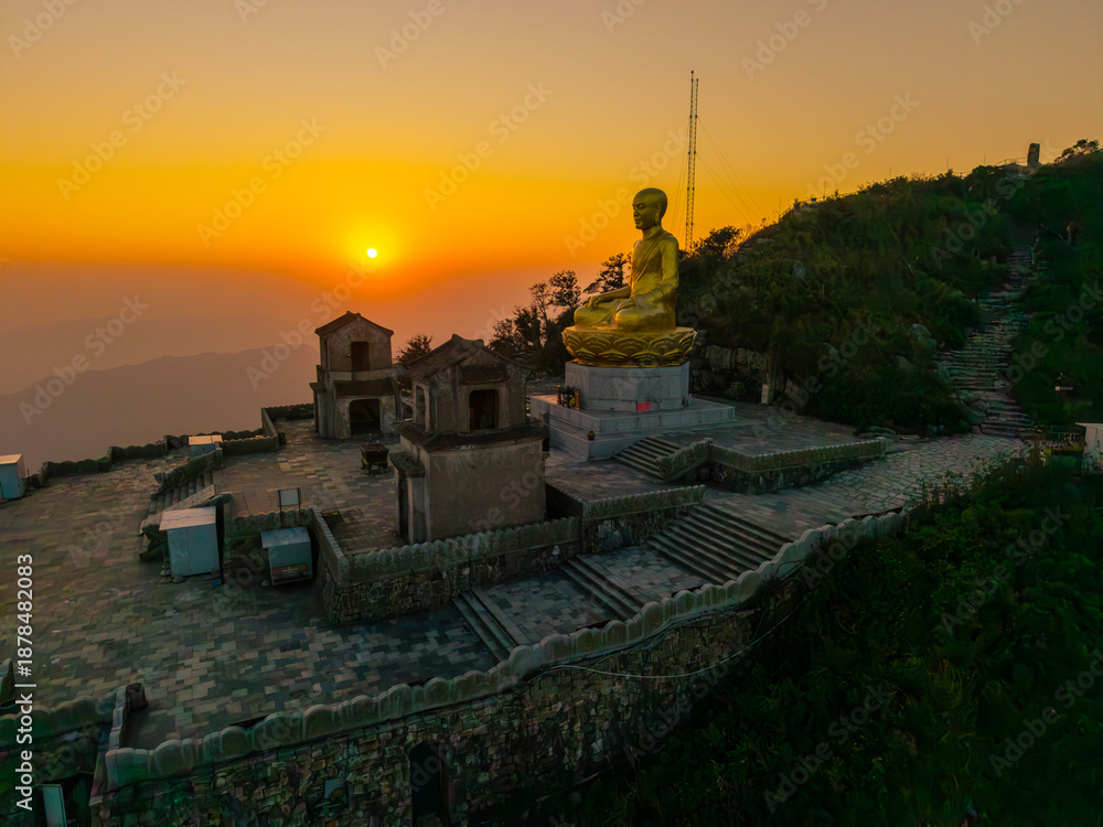 custom made wallpaper toronto digitalView of Golden statue of Buddha sitting in a lotus flower at ancient Buddhist complex at Yen Tu Mountain, Quang Ninh Province, Vietnam