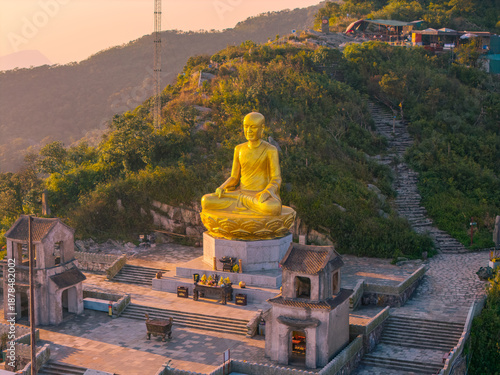 Wallpaper Mural View of Golden statue of Buddha sitting in a lotus flower at ancient Buddhist complex at Yen Tu Mountain, Quang Ninh Province, Vietnam Torontodigital.ca