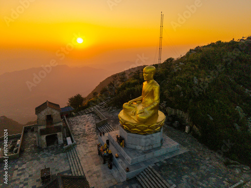 Wallpaper Mural View of Golden statue of Buddha sitting in a lotus flower at ancient Buddhist complex at Yen Tu Mountain, Quang Ninh Province, Vietnam Torontodigital.ca