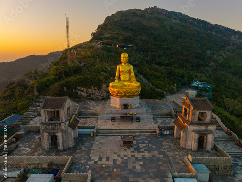 Wallpaper Mural View of Golden statue of Buddha sitting in a lotus flower at ancient Buddhist complex at Yen Tu Mountain, Quang Ninh Province, Vietnam Torontodigital.ca