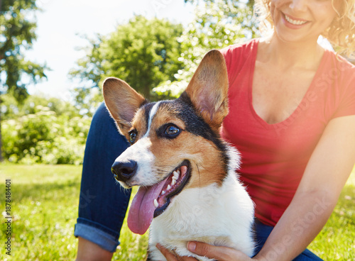 Love, trust and dog with woman in park for connection, bonding and animal adoption. Pet care, loyalty and happiness with person and welsh corgi outdoor for protection, relax and canine companion