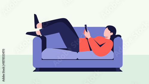 Woman relaxing on a sofa using her mobile phone.
